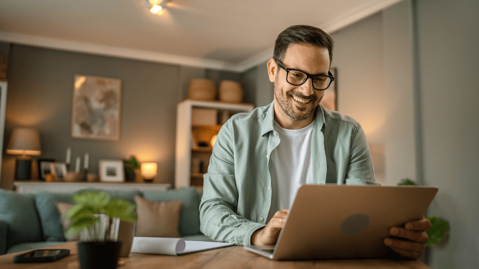 Smiling man with a laptop