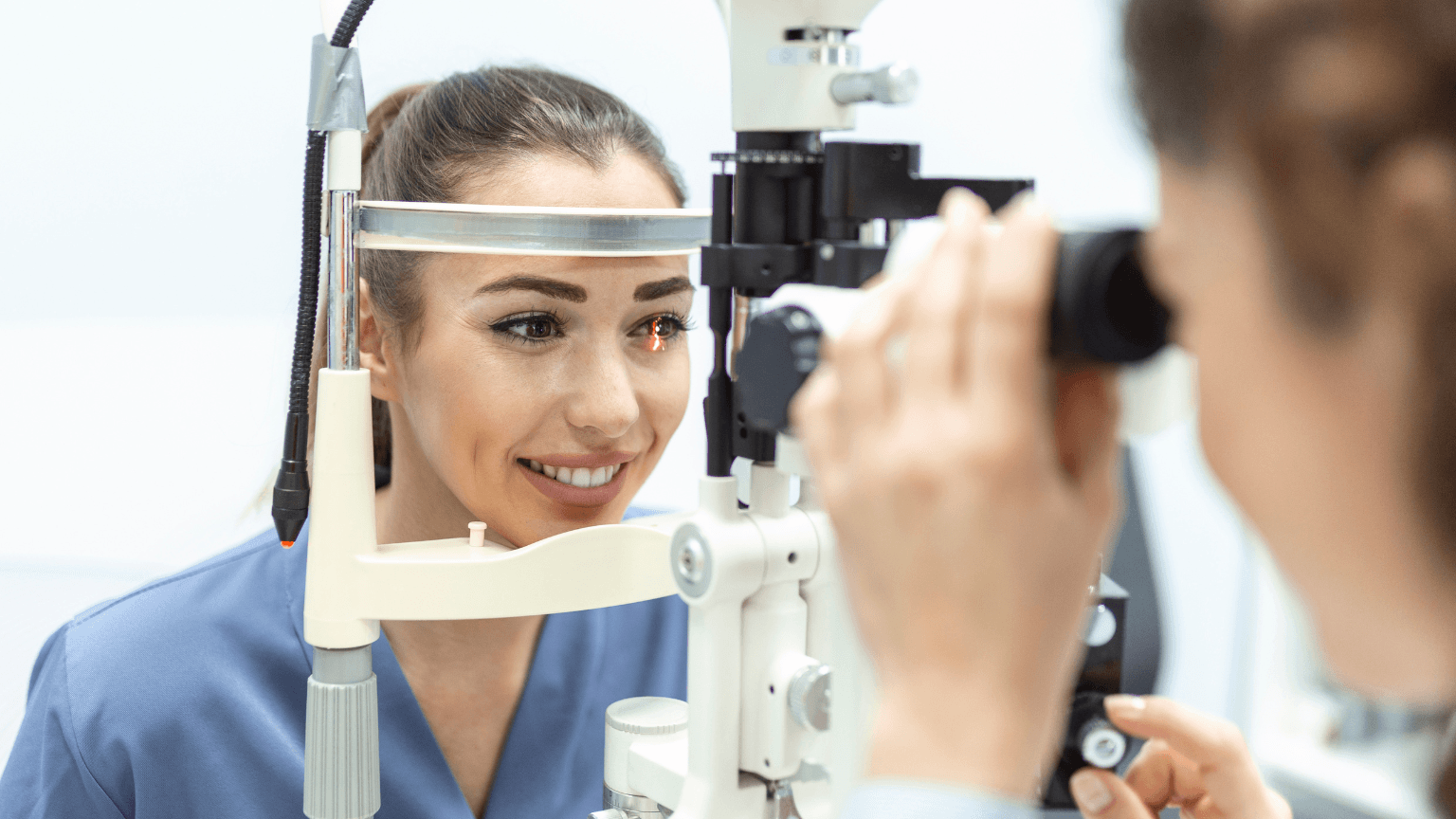 Eye doctor with female patient