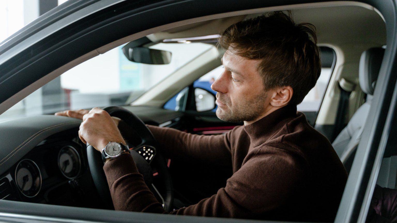 man in car