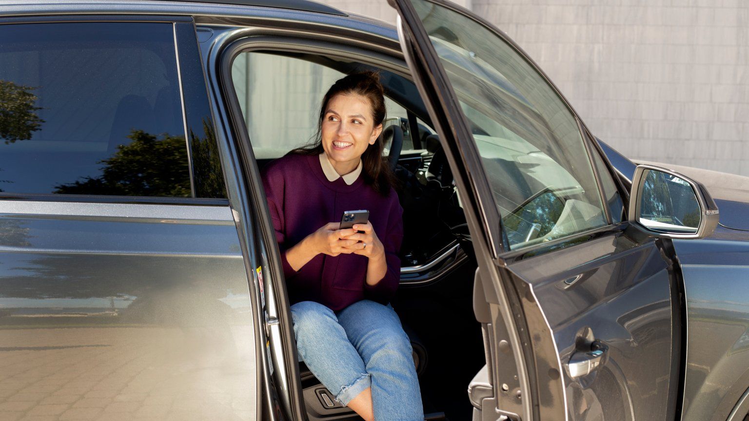 woman on phone in car